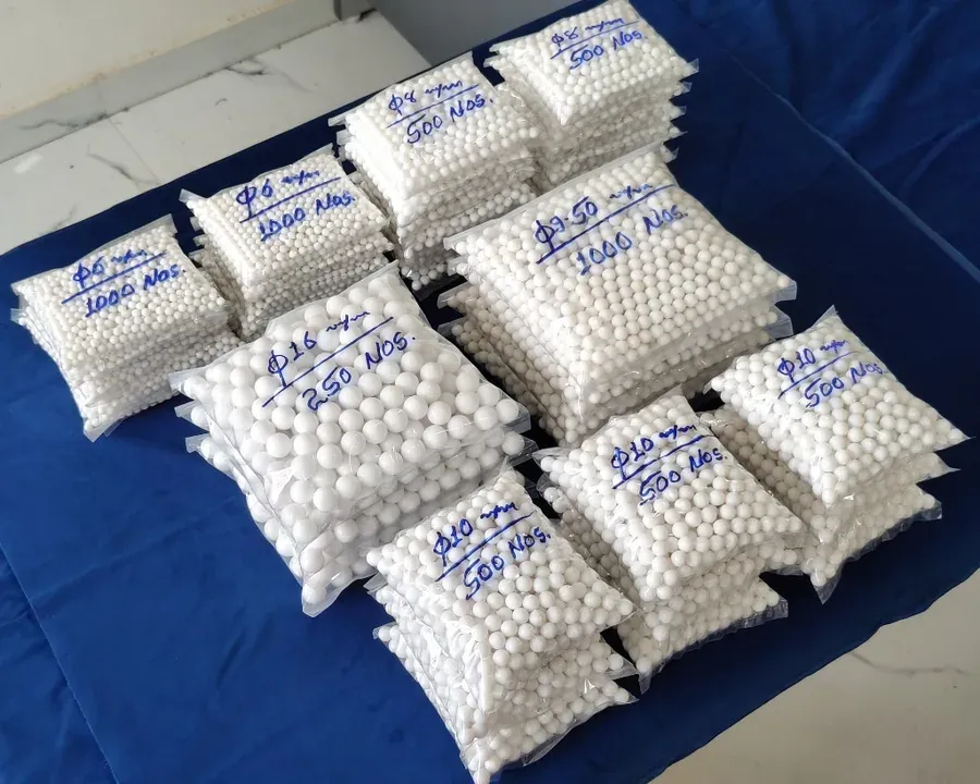 Standard-stock virgin PTFE balls bagged by diameter — 6 mm to 16 mm sizes labeled for B2B dispatch at Hemsun Engg. Industries